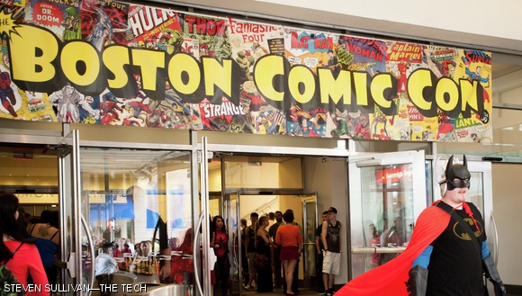 A cosplayer presumably dressed as SuperBatThor exits the Boston Comic Con.