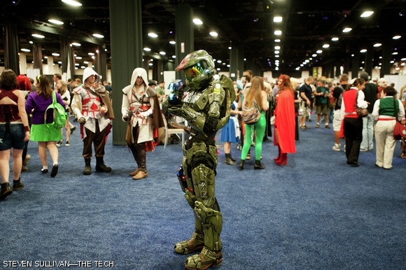A cosplayer dressed as Master Chief from the Halo video game series poses for fans.