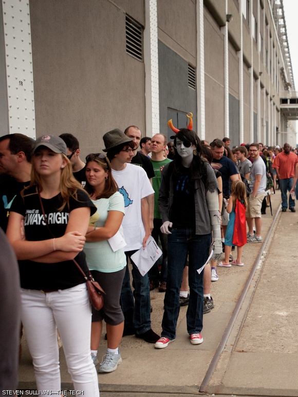 Comic book fans and cosplayers stand in a line wrapping around the back of the Seaport World Trade Center, this year’s location for Boston Comic Con.