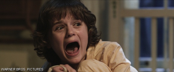 Joey King as Christine in the supernatural thriller The Conjuring.