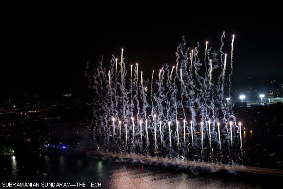 Independence Day fireworks seen over the Harvard bridge from the top of the Green Building.