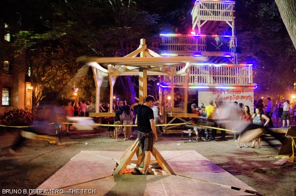 An East Campus resident operates the tilt-a-whirl ride at East Campus’ Sunday-night courtyard party. Attractions included a “frosh wash”, four-story fort, a swing set, a rotating rock wall, and a dance floor.
