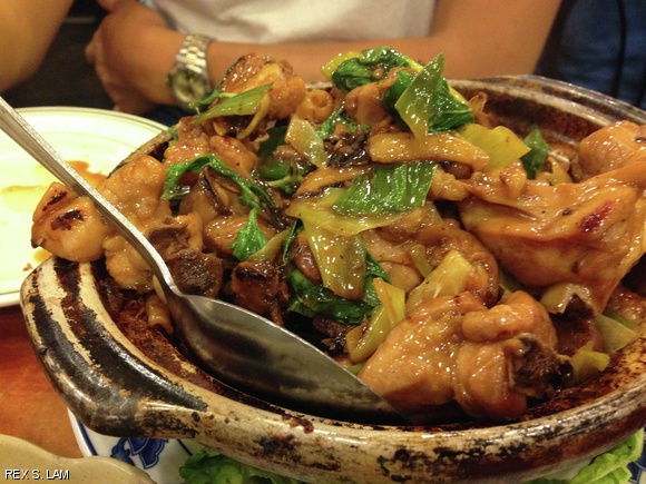 Simmered 3 Essence Chopped Chicken Legs in a hot pot, also known as sanbeiji, at Gourmet Dumpling House in Chinatown.