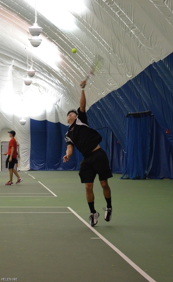Curtis L. Wu ’14 serves in Friday’s matchup against RPI. MIT took first in doubles and fifth in singles.