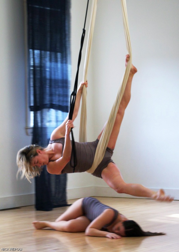 (Top to bottom) Jenny Carlson and Danielle DiVito in rehearsal for the aerial performance Ground.