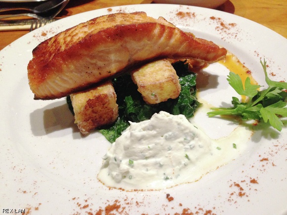 Salmon on blue cheese polenta at The Elephant Walk, a French-Cambodian restaurant with locations in Cambridge and Boston.