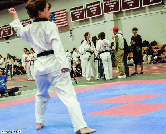 Lorraine Ling G competes in the poomsae (form) event at the MIT Taekwondo Tournament held in Johnson Athletic Center on Oct. 20. Judges determine the scoring for poomsae based on the correct execution of the movements and the rhythm of the form.