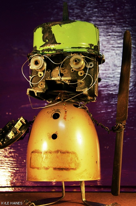 “Pugilist Oil Co.” from Haines’ series “God’s Golden Garbage,” created in 2011 from oilcans, steel wire, and antique fuses.