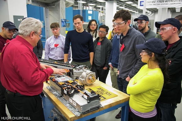 Doug Drauch, employee of General Motors, gives Leaders of Global Operations students a tour of the General Motors facilities during IAP.
