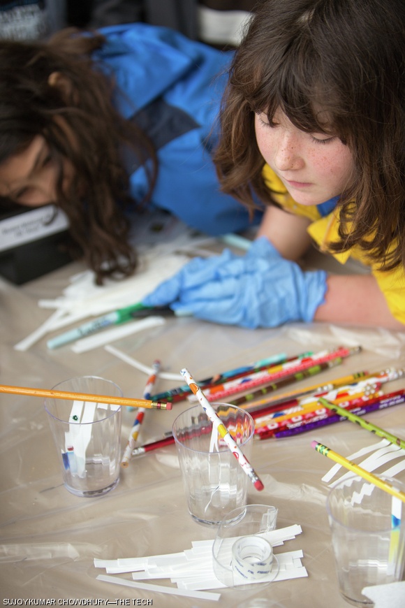 Two young scientists watch as a marker’s ink is separated into its components in a procedure called chromatography after a presentation hosted by MIT’s Marerials Science and Engineering Department last Saturday, May 10, in Kresge Auditorium. The department presented on ‘Materials with Magical Properties’ and conducted on-stage demonstrations in which elementary, middle and high school students could volunteer.