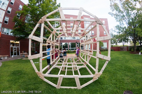 Students of Next House building an Inception-inspired 9’ diameter rotating room, which was unveiled during REX.