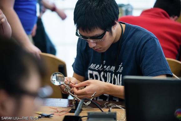 Hans V. Susilo ‘14 prepares to solder wire for his project.