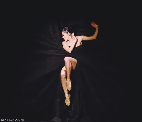 Rie Ichikawa struggles in the embrace of black curtain during the performance of Jirí Kylián’s Bella Figura.