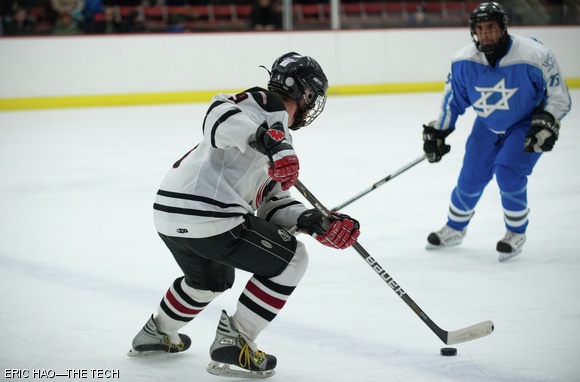 Riley E. Brandt G attempts to maneuver past an opponent on the Israel National Ice Hockey Team on Saturday, March 1. MIT lost by one goal after trailing 3-7 in the third period.