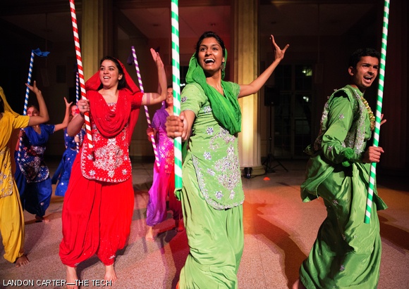 MIT Bhangra dancers (from left) Keerti Shukla ’15, Nikita K. Kodali ’17, and Aneesh M. Anand ’17 perform.