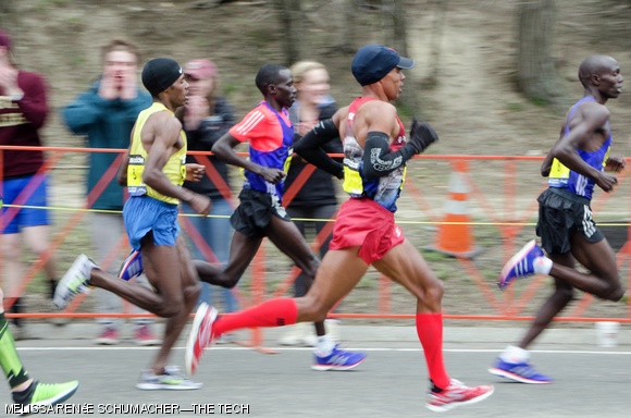 Meb Keflezighi and the lead group of the male elite field push on after covering Heartbreak Hill.
