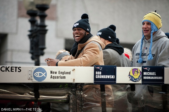 New England Patriots players (from right) Tim Wright and Rob Gronkowski smile to the fans during Wednesday’s victory parade following their Superbowl win.