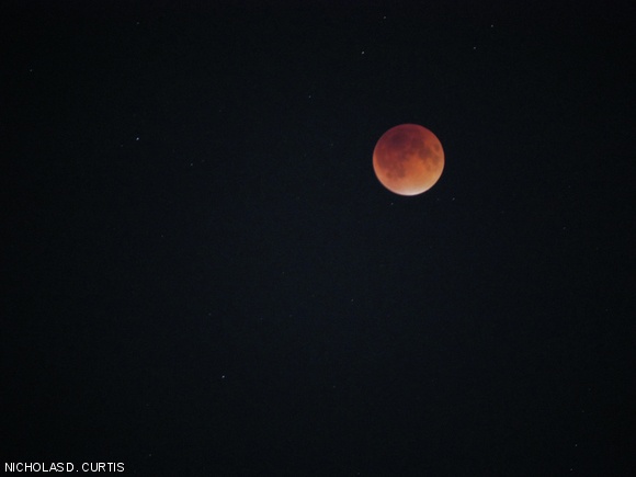 A “blood moon” lit the night sky on Sunday. A lunar tetrad, or a fourth consecutive total lunar eclipse with no partial eclipses in between, coincided with a supermoon, or a full moon that is also at its closest approach to Earth in its orbit.
