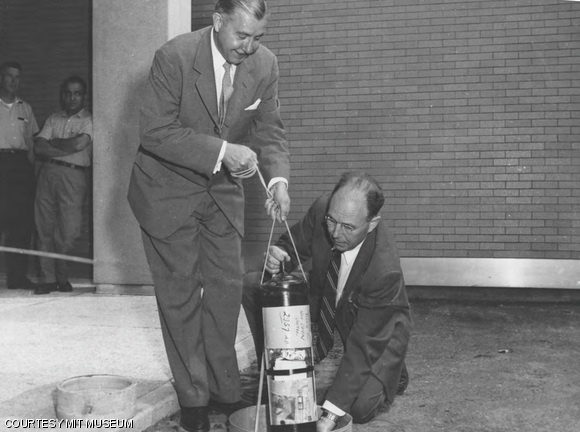 Prof. Harold E. Edgerton and then-MIT President James R. Killian, Jr. plant a time capsule next to Building 26 in June 1957. The capsule was found by the MIT.nano construction crew last week.