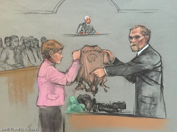 Massachusetts chief medical examiner Henry Nields presents the tattered clothes of 8-year-old Martin Richards, who died in the Boston Marathon bombings.